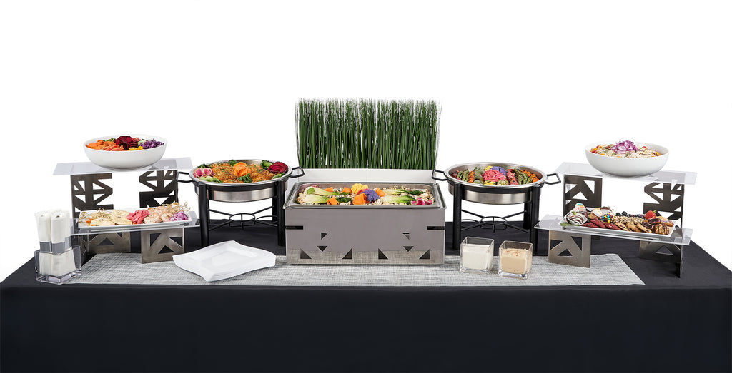 A buffet table with a Single Entree Package of dessert and sides on it.