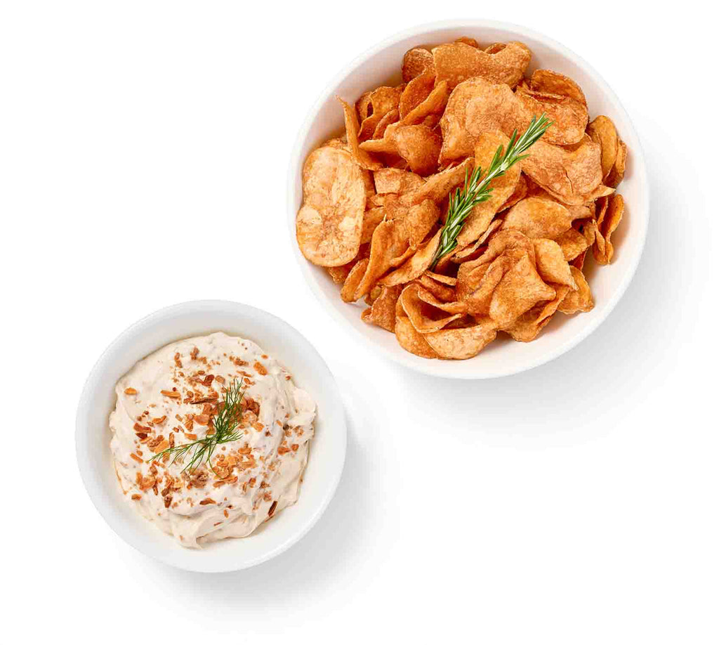 Two bowls of Homemade Chips and Dip on a white background.