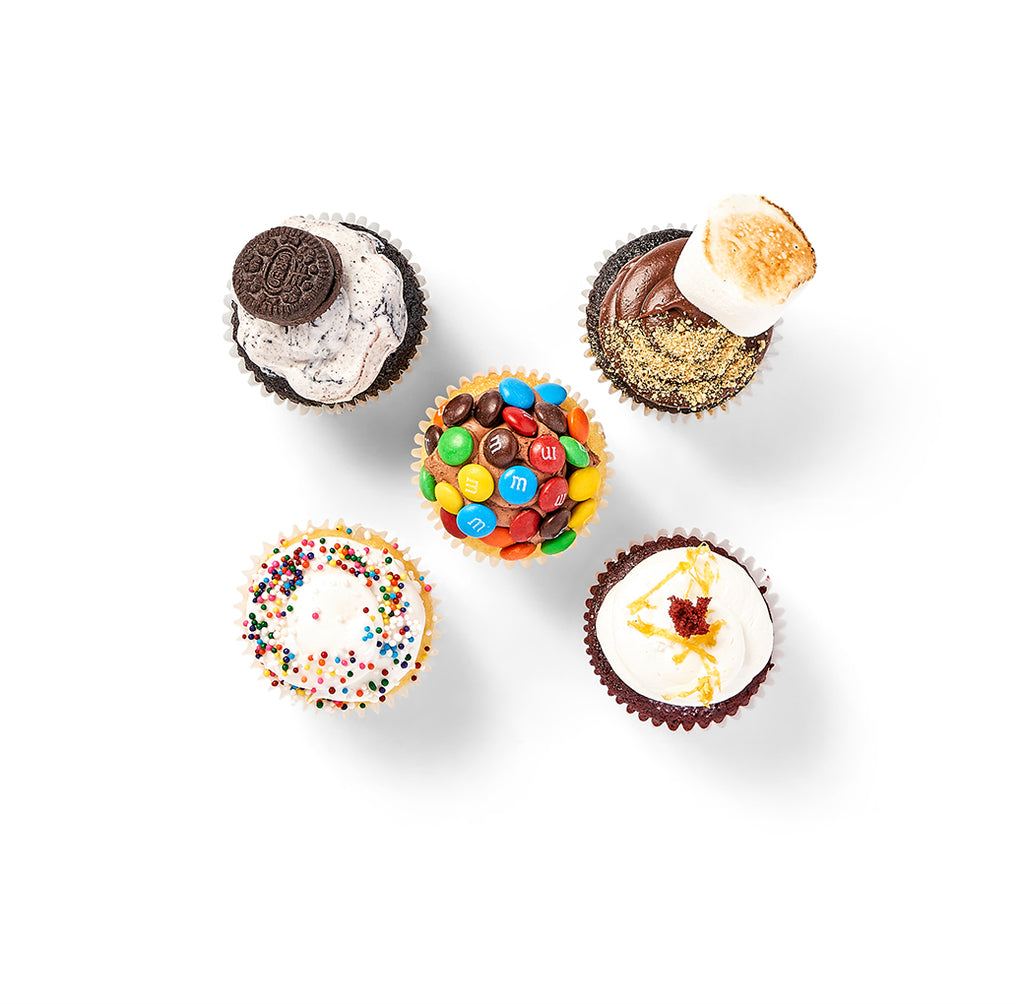 Four Mini Cupcakes are arranged in a circle on a white background.