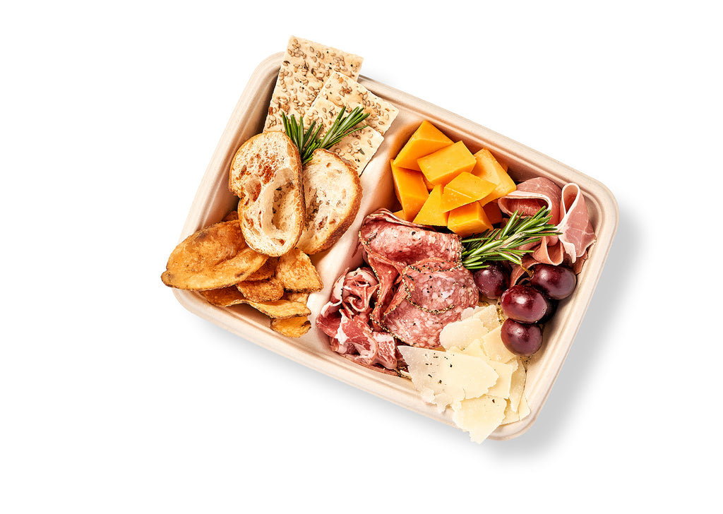 A Antipasti and Cheese Snack Box filled with salami, prosciutto, and crackers.