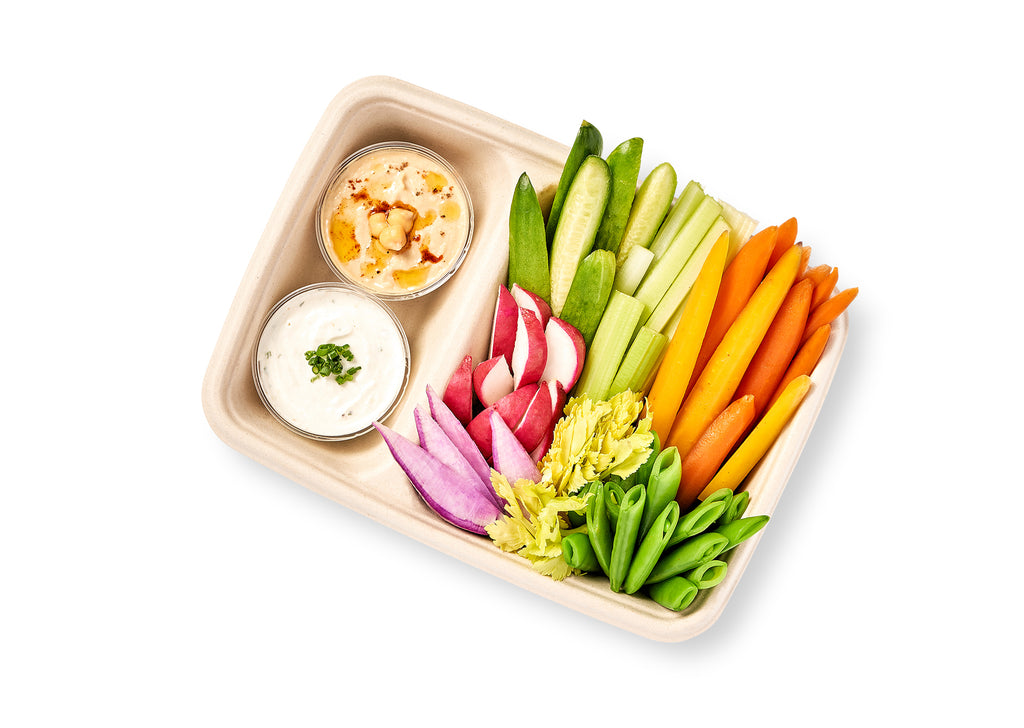 A Crunchy Crudité Snack Box filled with seasonal baby vegetables and dip.