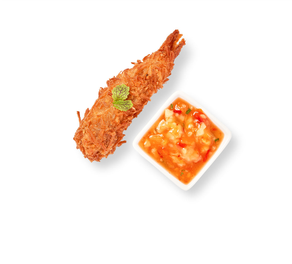 Accompanied by Chili-Mango Salsa, Coconut-Crusted Jumbo Shrimp on a plate.