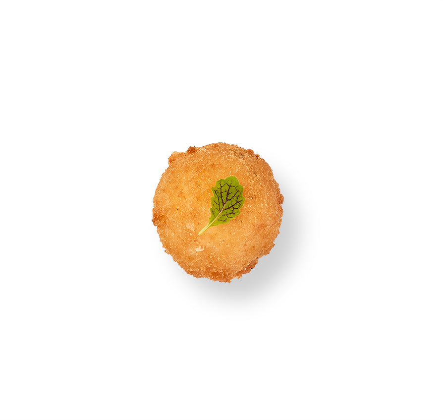 A small Mac and Cheese Fritter with a mint leaf on top, topped with Fontina cheese.
