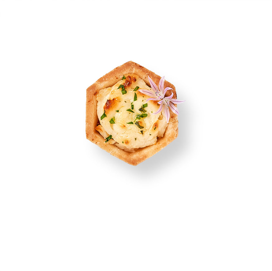 An image of Manchego and Quince Tartlets, crispy tart shells filled with Spanish Manchego cheese, on a white background.