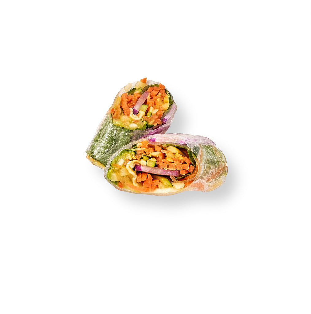 Seasonal Vietnamese summer rolls filled with protein and vegetables on a white background.