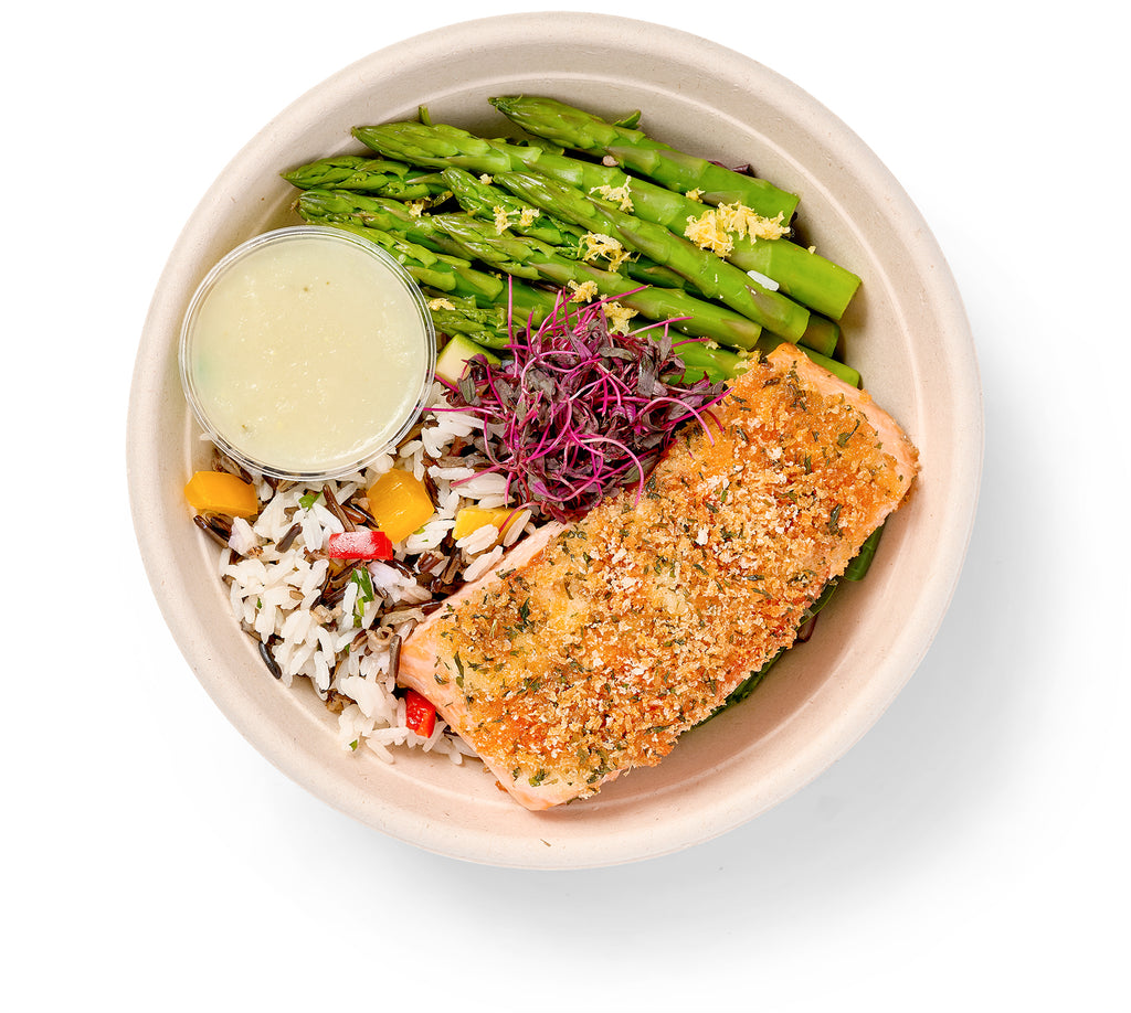 A Mustard Crusted Entree Bowl with lemon grilled asparagus, basmati rice, and salmon.