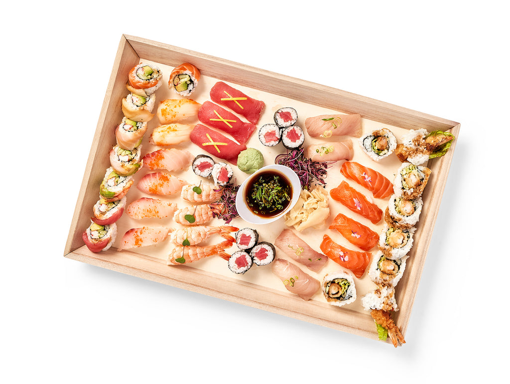 A wooden tray with a Sushi Platter on it.