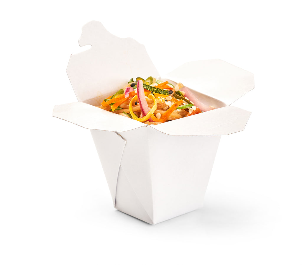 Sauteed Asian Sesame Noodles in a Mini Takeout box on a white background with julienne vegetables garnished.