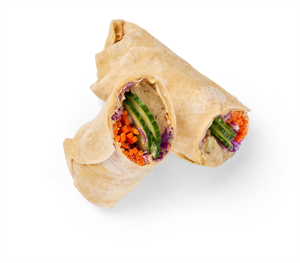 A Grilled Eggplant Wrap with vegetables and carrots on a white background.