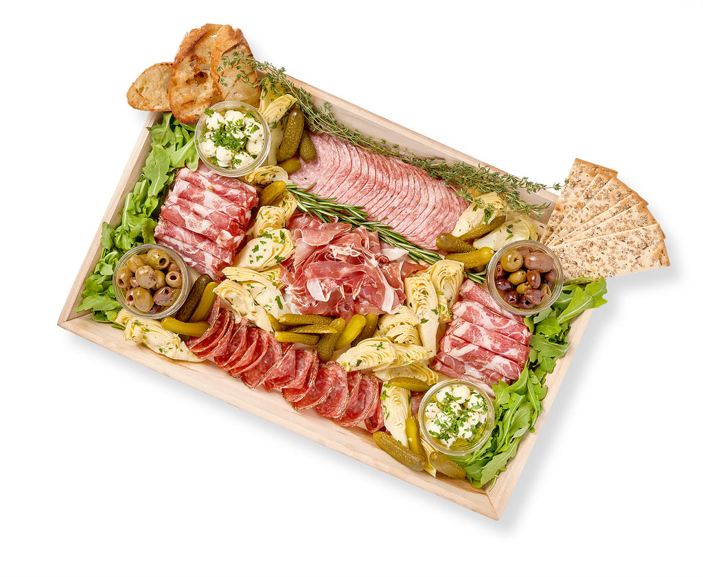 An Antipasti Platter with a variety of meats, including salami, and vegetables, such as artichokes and mozzarella.